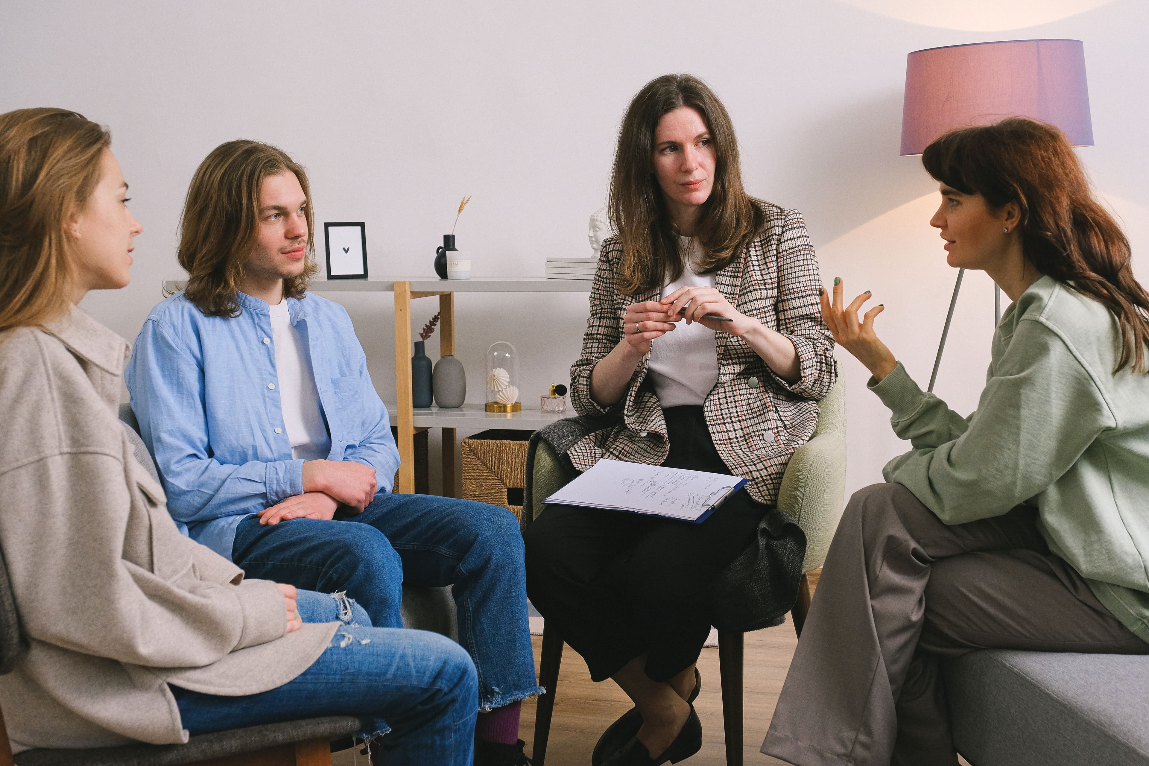 Small group talking together in a bright living room